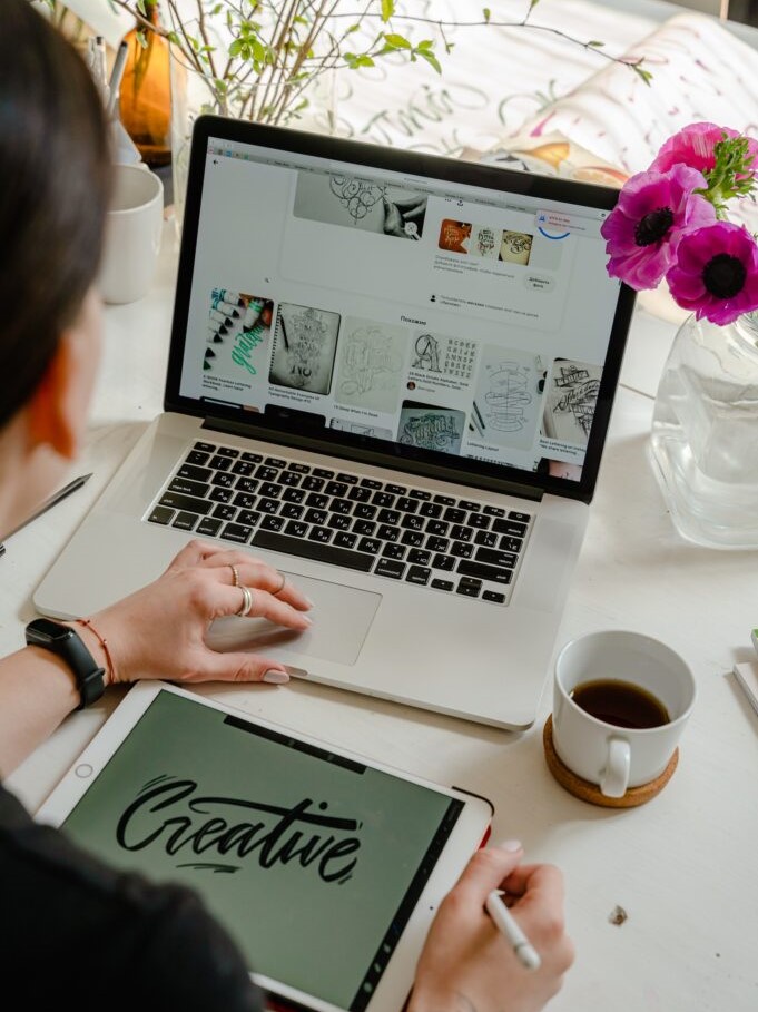 Woman working on creative files on laptop