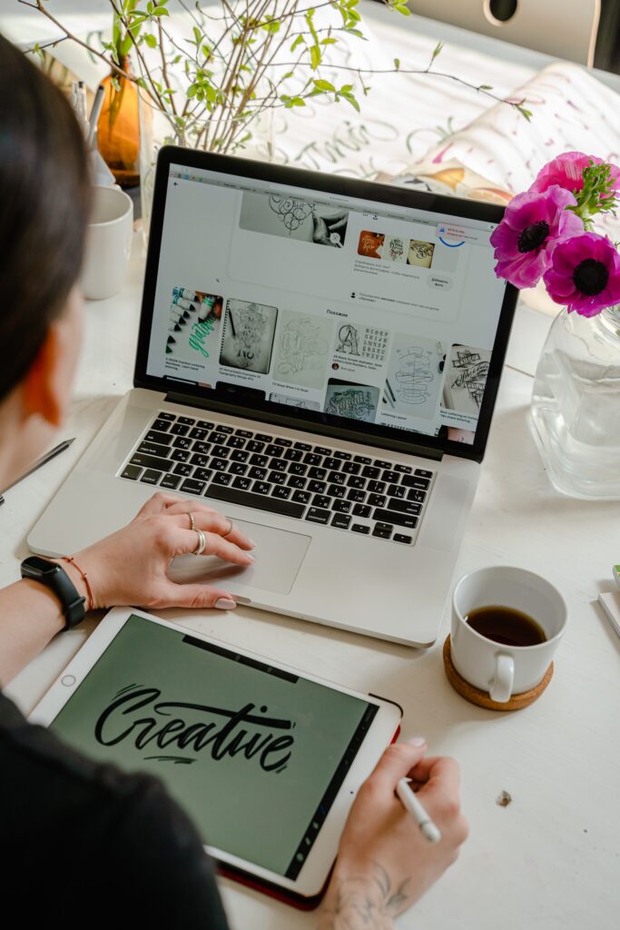 Woman looking at creative files on laptop